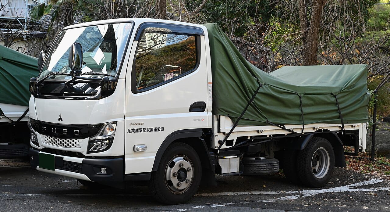 2021 Mitsubishi Canter FE85 4.2t Dropside — front three-quarter view